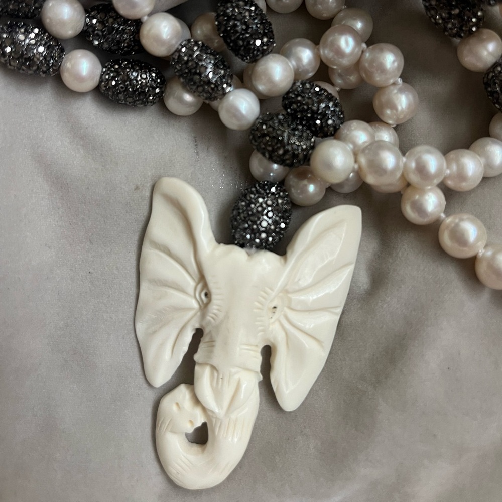 Elegant Pearl and Black Beaded Necklace with Elephant Pendant